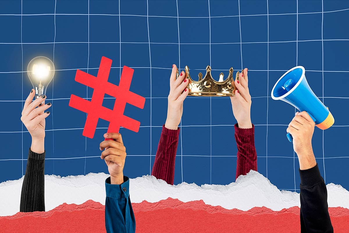 Raised hands holding a megaphone, hashtag and light bulb